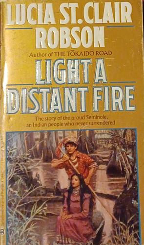 Light a Distant Fire by Lucia St. Clair Robson