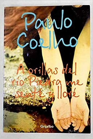 A Orillas del Rio Piedra Me Sente y Llore by Paulo Coelho