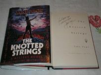 The Knotted Strings by Jake Page