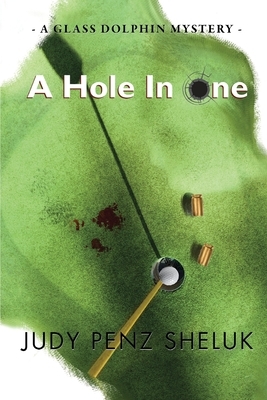 A Hole in One: A Glass Dolphin Mystery by Judy Penz Sheluk