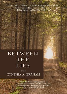 Between the Lies by Cynthia A. Graham