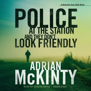 Police at the Station and They Don't Look Friendly by Adrian McKinty