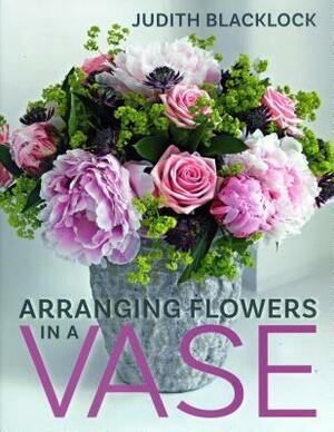 Arranging Flowers in a Vase by Judith Blacklock