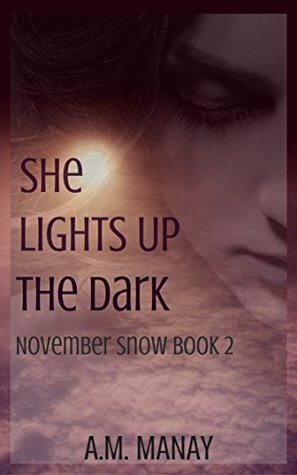 She Lights Up the Dark by A.M. Manay