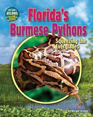 Florida's Burmese Pythons: Squeezing the Everglades by Miriam Aronin