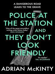 Police at the Station and They Don't Look Friendly by Adrian McKinty